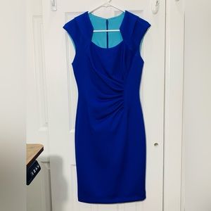 Calvin Klein cocktail dress, form fitting with shoulder and chest framing